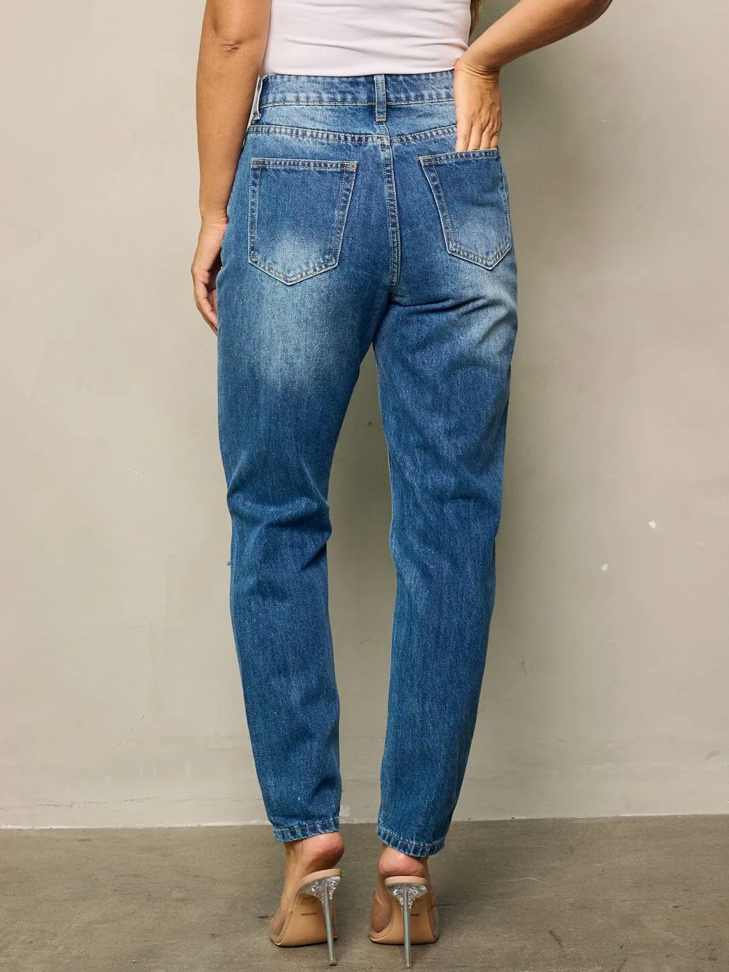 WOMEN'S BUTTON CLOSURE WASHED DISTRESSED DENIM PANTS